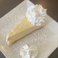 Cheesecake · cream cheese & graham cracker crumb crust, whipped cream, powdered sugar