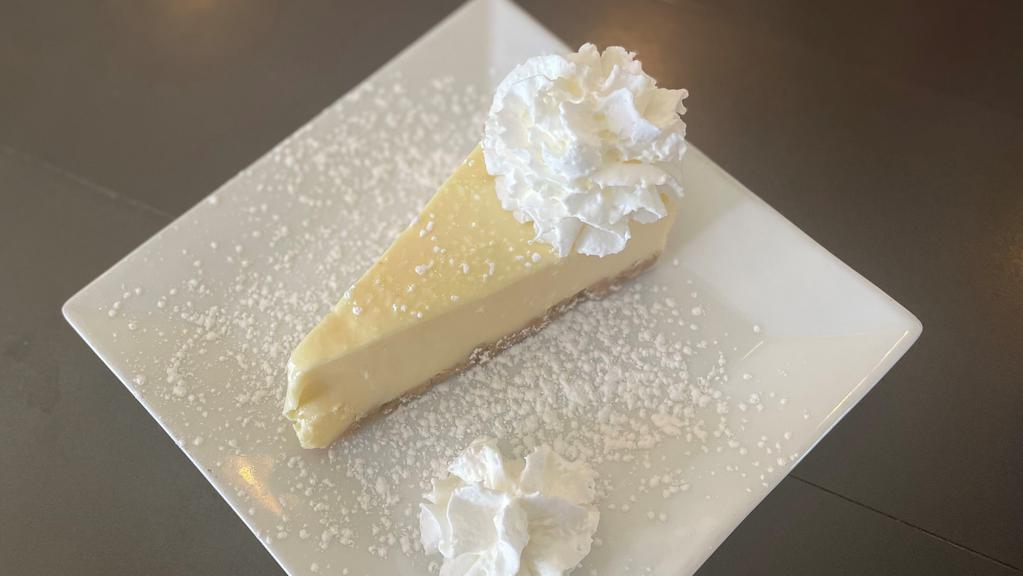 Cheesecake · cream cheese & graham cracker crumb crust, whipped cream, powdered sugar