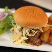 Pulled Pork Sandwich (Gf) · Southern style pulled pork shoulder with homemade bourbon BBQ sauce and spicy slaw on gluten...