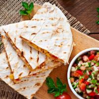 Chicken Quesadilla · Hot off the griddle, mouthwatering quesadilla made with Chicken, a fine blend of cheeses, pe...
