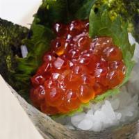 Ikura Handroll · Salmon roe and shiso leaf.