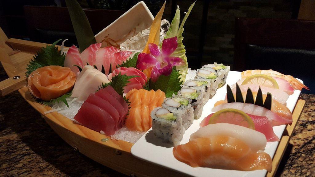 Sushi & Sashimi Combo · Seven pcs sushi and nine pcs sashimi and one California roll.