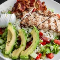 Chicken Cobb Salad · Grilled chicken, romaine and field greens, bacon, feta cheese, egg, tomatoes, cucumbers, and...