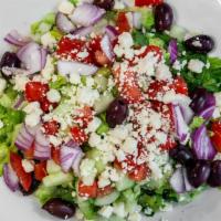 Greek Salad · Romaine, feta cheese, olives, red onion, grape leaves, tomatoes, and cucumbers with oil and ...