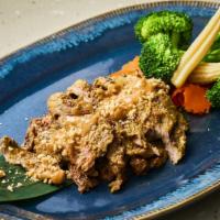 Nuea Yaan Satay · Grilled marinated tender beef served with peanut sauce, steamed mixed vegetables and black b...