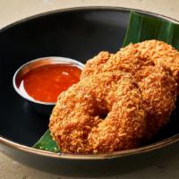 Tord Mun Goong · Deep fried shrimp cake served with sweet chili sauce.