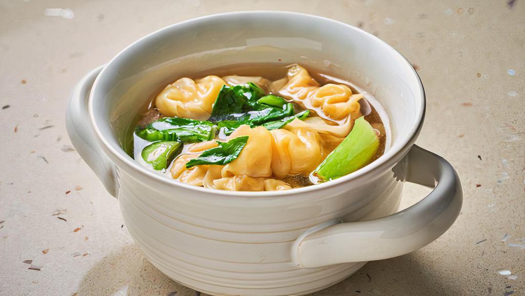 Wonton Soup · Chicken broth soup with chicken wonton and bok choy.