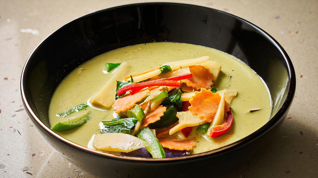 Gaeng Kiew Warn · Thai style green curry with bamboo shoot, basil leaves, carrot, eggplant, green bean and bell pepper simmered in coconut milk.
