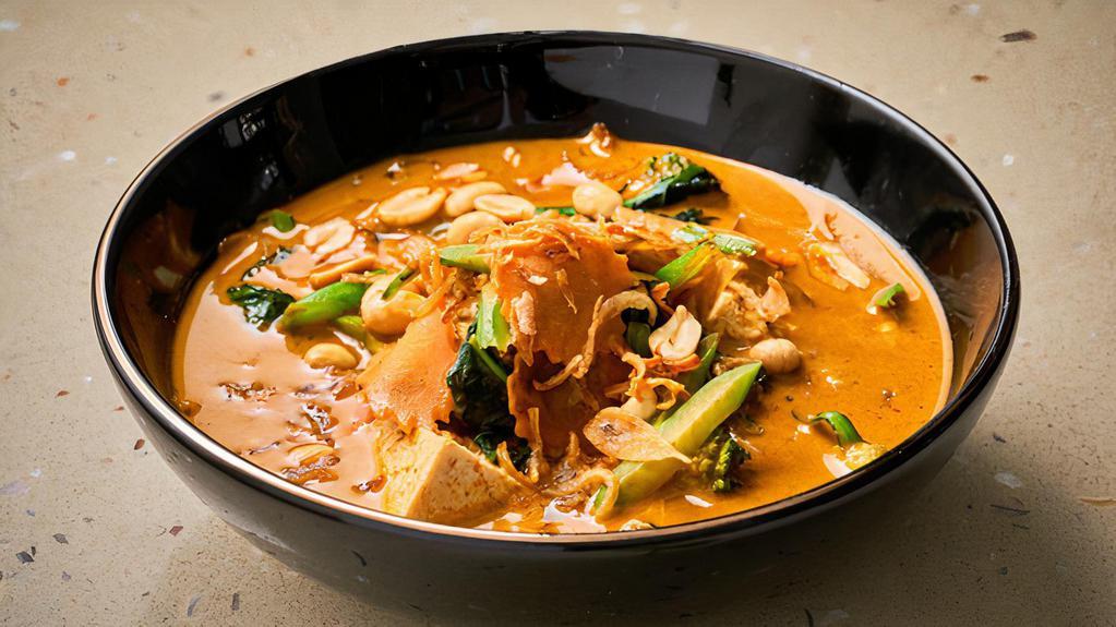 Gaeng Massaman Curry · Indian inspired spices blended in chili paste with onion, potato, carrot, avocado and peanut simmered in coconut milk.