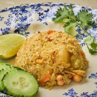 Khao Phad Sup Pa Rod · Pineapple fried rice with choice of meat, yellow curry powder, cilantro, cashew nut, carrot,...