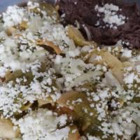 Chilaquiles · Corn tortillas cut in quarters lightly fried and served with savory green sauce. Add Grilled...