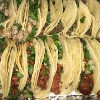 Taquiza 20 Street Tacos  · Twenty tacos with mixed protein, cilantro, onios,cucmbers,radish,and limes. red sauce and gr...