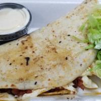 Quesadilla · Corn tortilla or flour tortilla served with a protein of your choice or mushrooms, light Mex...