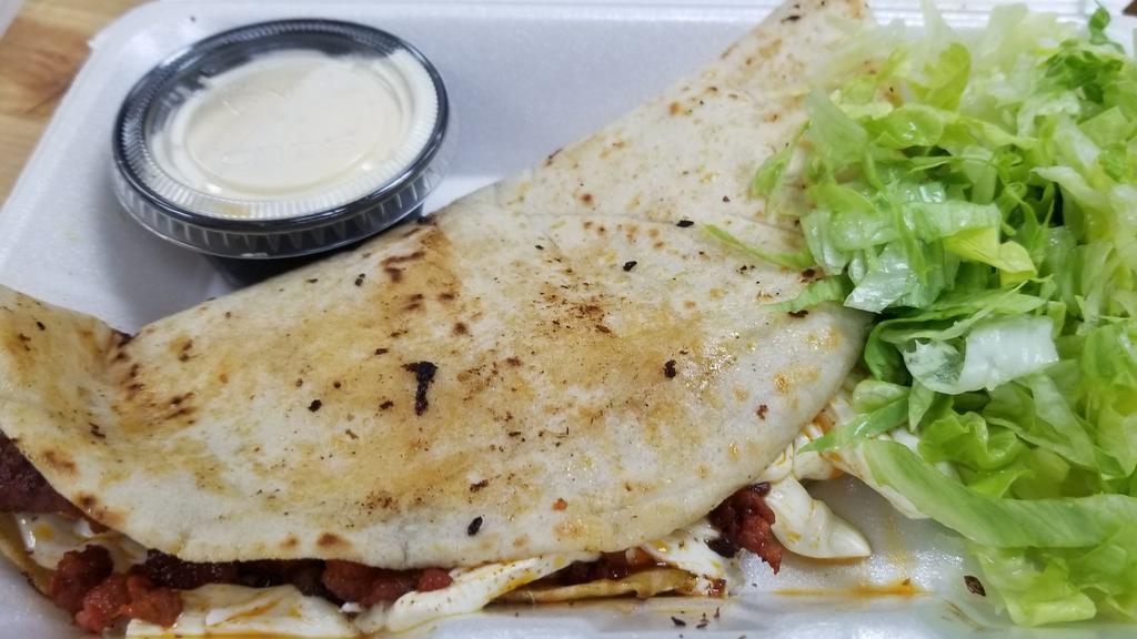 Quesadilla · Corn tortilla or flour tortilla served with a protein of your choice or mushrooms, light Mexican sour cream, and lettuce.