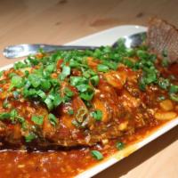 Braised Whole Fish With Hot Bean Sauce/豆瓣全鱼 · Braised Whole Tilapia Fish with sweet, sour, and mild  spicy hot bean sauce. The best for wh...