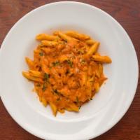 Penne Alla Vodka · A classic tomato cream sauce infused with parma prosciutto, smoked ham, and sweet onions.
