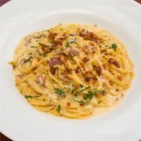 Spaghetti Carbonara · Classic Lazian cream sauce made with pancetta, bacon, sweet onions, and the finest reggiano ...