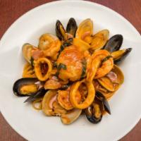 Linguine Frutti Di Mare · Sautéed calamari, shrimp, clams, mussels, and scallops are married together in a flavorful t...