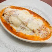 Lasagna Bolognese · Layered sheets of pasta with rice bolognese meat and ricotta cheese filling. Topped with tom...