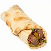 Kafta Lamb Kebab Classic Roll · Grilled seasoned ground lamb & beef, parsley-onion mix, hummus and cucumber pickles