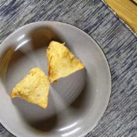 Samosas (2 Pcs) · Most popular. Two pieces. Crispy turnovers filled with your choice of filling.