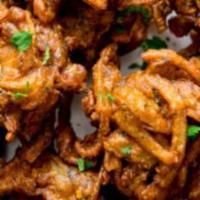 Onion Bhaji · Six pieces. Sliced onions and lentil fritters.