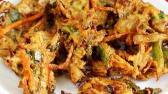 Vegetable Pakora · Mixed vegetables, dipped in gram flour and seasoning blend and fried to perfection.