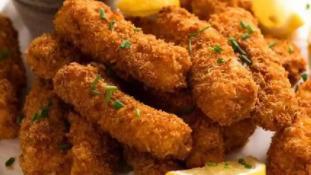 Fish Fingers · Crispy, golden fluke fingers marinated dipped roasted with tempura flour and deep fried. Served with a dip sauce.