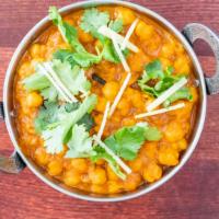Chana Masala · Most popular. Chickpeas, curry in tangy tomato and onion sauce. Served with basmati rice. Ve...
