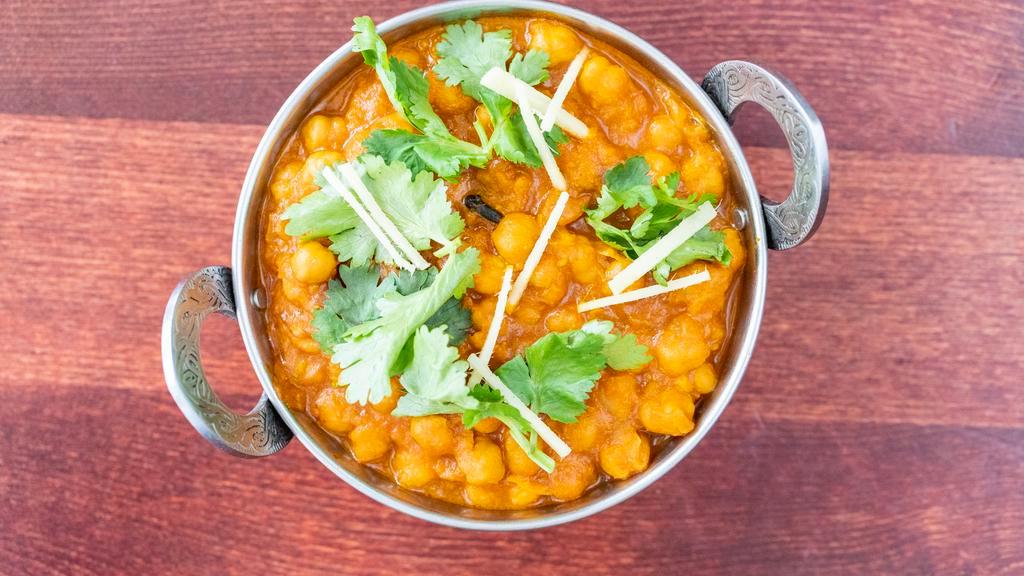 Chana Masala · Most popular. Chickpeas, curry in tangy tomato and onion sauce. Served with basmati rice. Vegetarian.