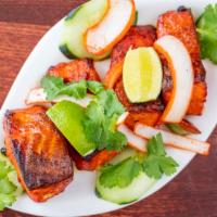 Grilled Salmon Tikka · Marinated salmon cubes barbecued with mild herbs and spices.