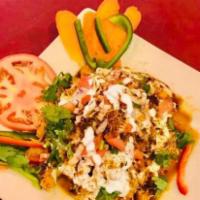 Samosa Chaat · Pieces of samosas served with chickpeas and topped with yogurt, fresh tamarind sauce, and sp...