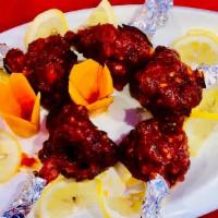 Chicken Lollipop (Dry) · Chicken drumsticks marinated in Indian spices and fried to perfection.
