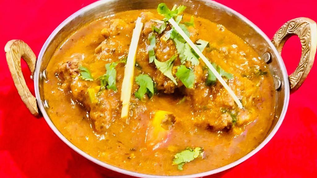 Chicken Curry · Chicken cooked in authentic Indian curry.