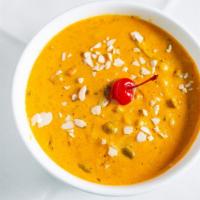 Navratan Korma · Mixed vegetables cooked in a mild curry sauce, garnished with dry fruit.