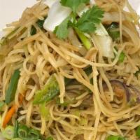 Hakka Noodles · Soft lo-mein noodles topped with your choice of chicken or shrimp, mixed vegetables, and sau...