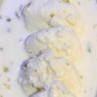 Rasmalai · Creamed cheese patties in sweetened reduced milk, flavored with cardamom and garnished with ...