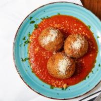 Arancini · Risotto, mozzarella and tomato sauce.