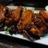 Kutty Wings · seasoned and fried wings naked or tossed with your choice of sauce