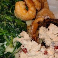 Kings Surf N Turf · succulent chefs cut steak topped w/ lump crab meat and shrimp. truffle rustic mashed potatoe...
