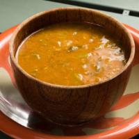 House Soup · Velvety smooth soup from red lentils and caramelized onions.