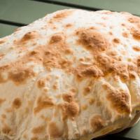 Pita Bread · Fresh unleavened bread baked to order.