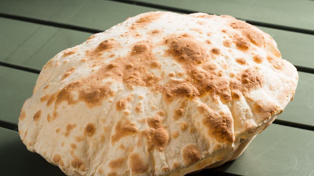 Pita Bread · Fresh unleavened bread baked to order.