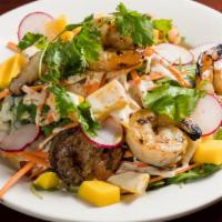 Grilled Shrimps · With arugula and mango.