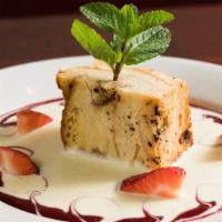 Bread Pudding · Comes with raisins and creme anglaise.