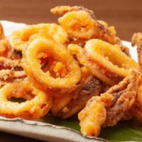Fried Calamari · Flash-fried squid, golden on the outside and perfectly chewy on the inside. Served with a sq...