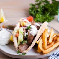 Lamb Gyro · Pita filled with lamb, lettuce, tomatoes, cucumber, onions, pickles, white sauce and hot sau...