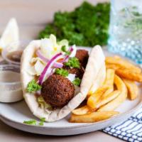 Falafel Gyro · Pita filled with crispy falafel, lettuce, tomatoes, cucumber, onions, pickles, white sauce a...
