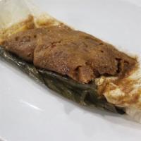 Pasteles - Award Winning · Plantain boiled filled with pork. A 