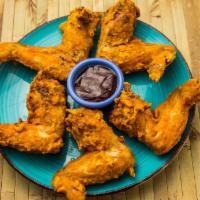 Freakin Crispy Wings · 5 Delicious perfectly fried jumbo wings battered in flour, freakin rican adobo, and other fi...